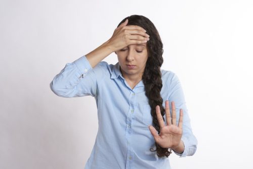 woman holding head