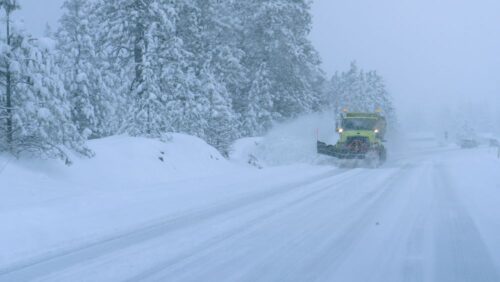 truck ploughing snow and winter driving hazards